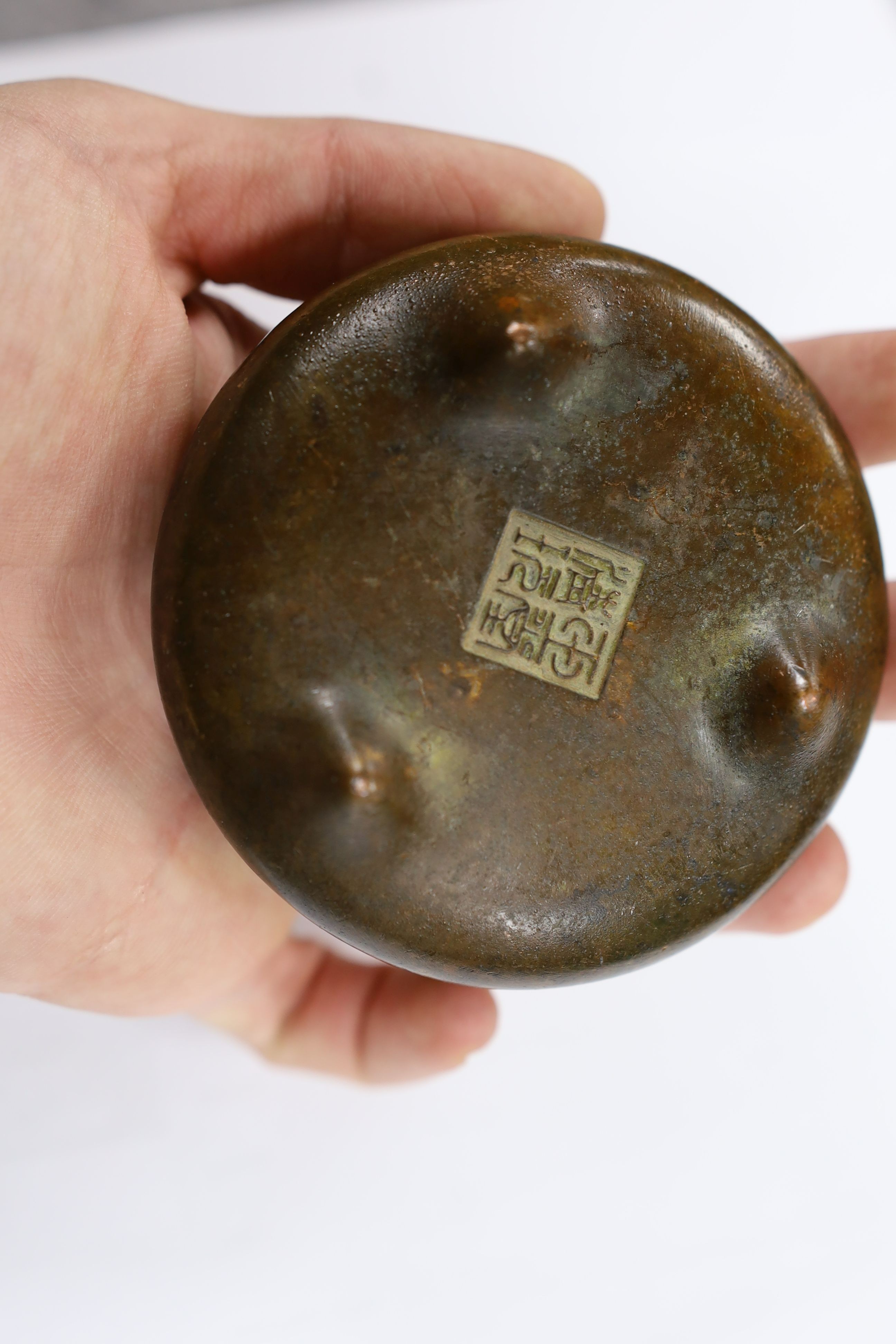 Two Chinese bronze censers, largest 11cms diameter
